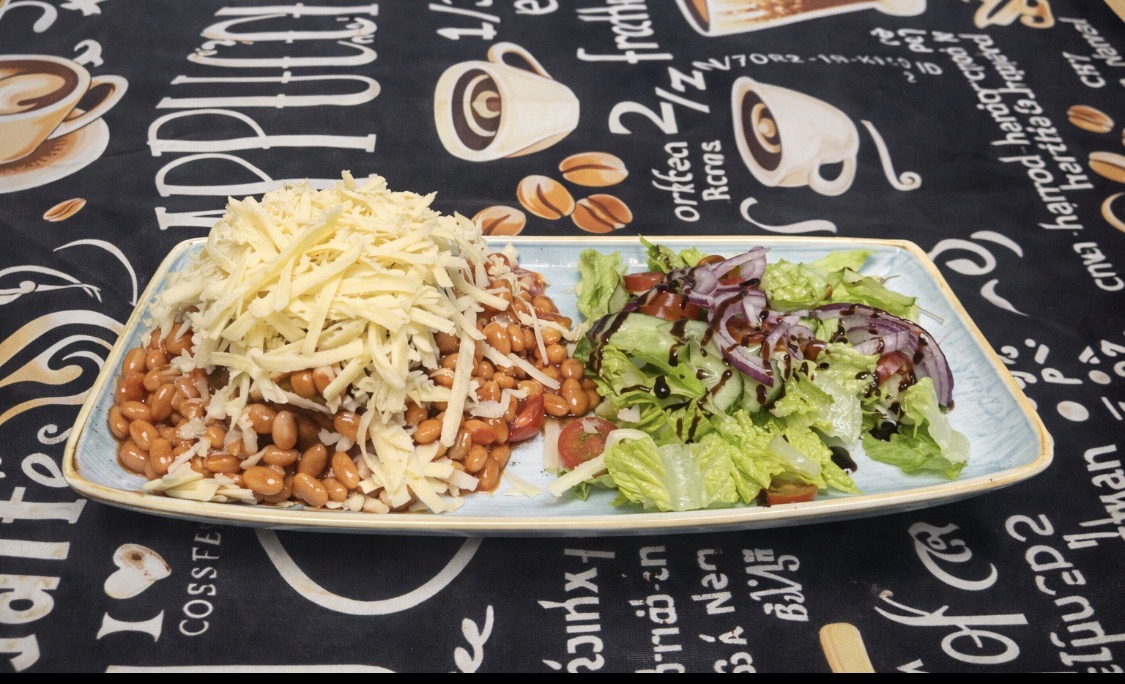 Beans and cheese served with salad