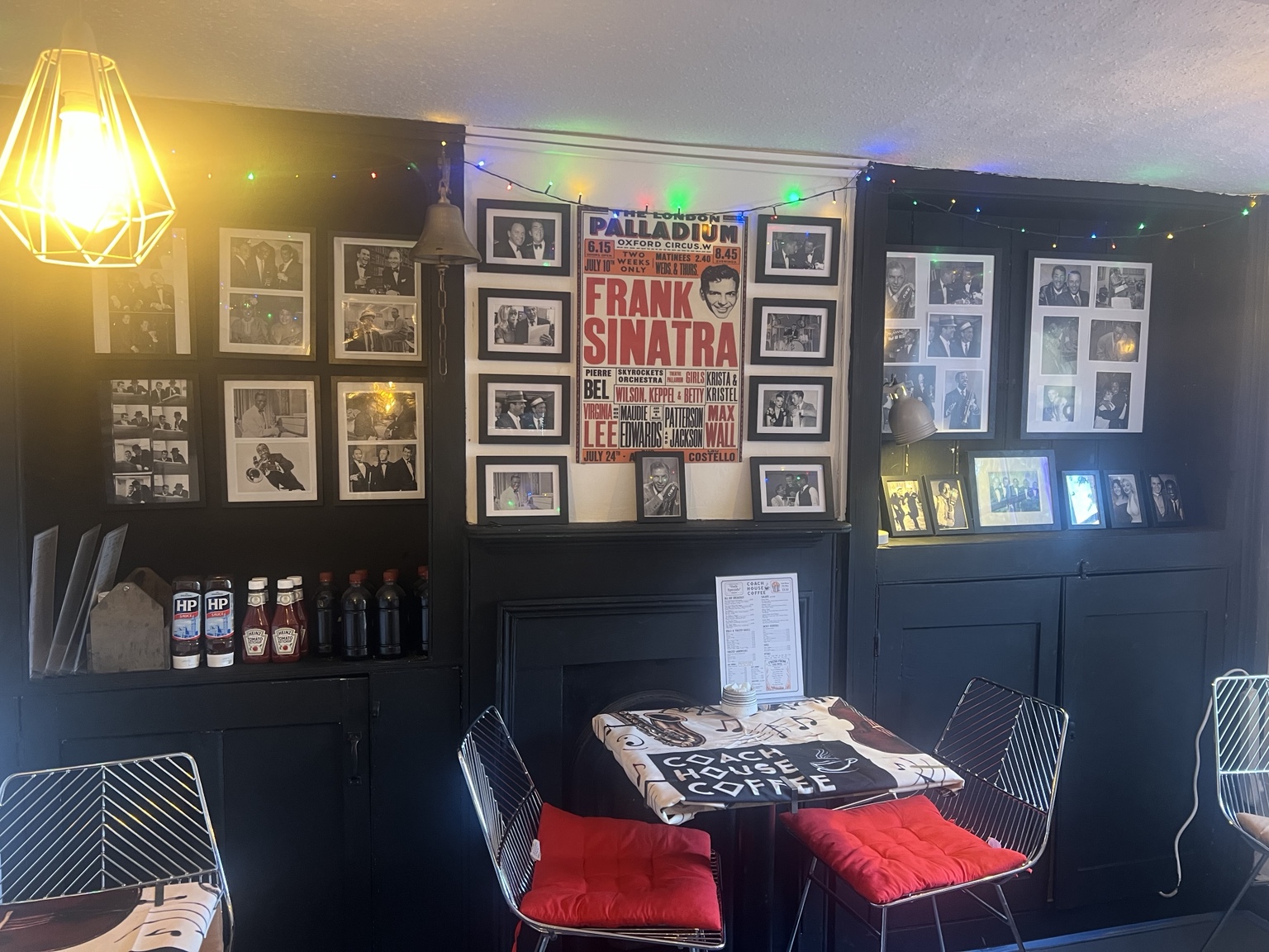 Coach House Coffee seating beneath the Rat Pack gallery wall